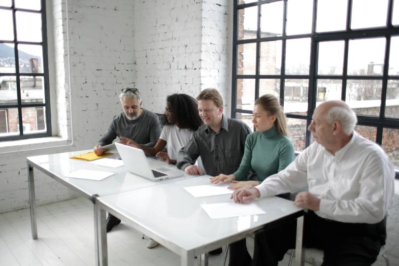 a panel of interviewers of different races interviews a candidate, to avoid bias in recruitment