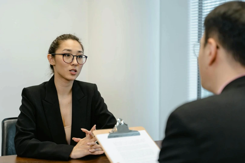 person interviews a candidate for an NHS position