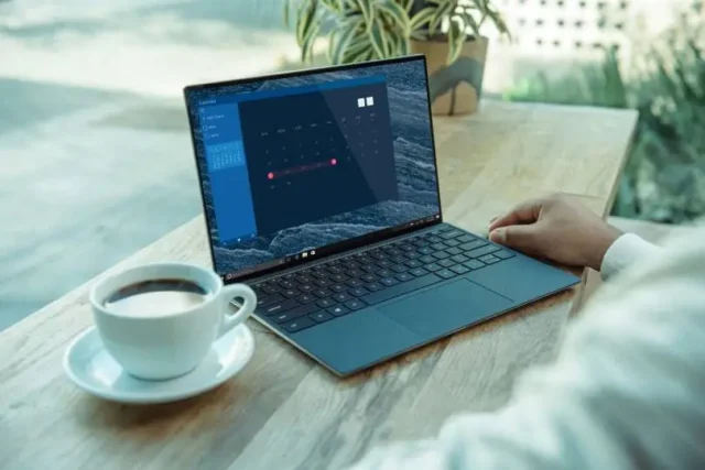 Man looks at diversity recruiting metrics on a laptop