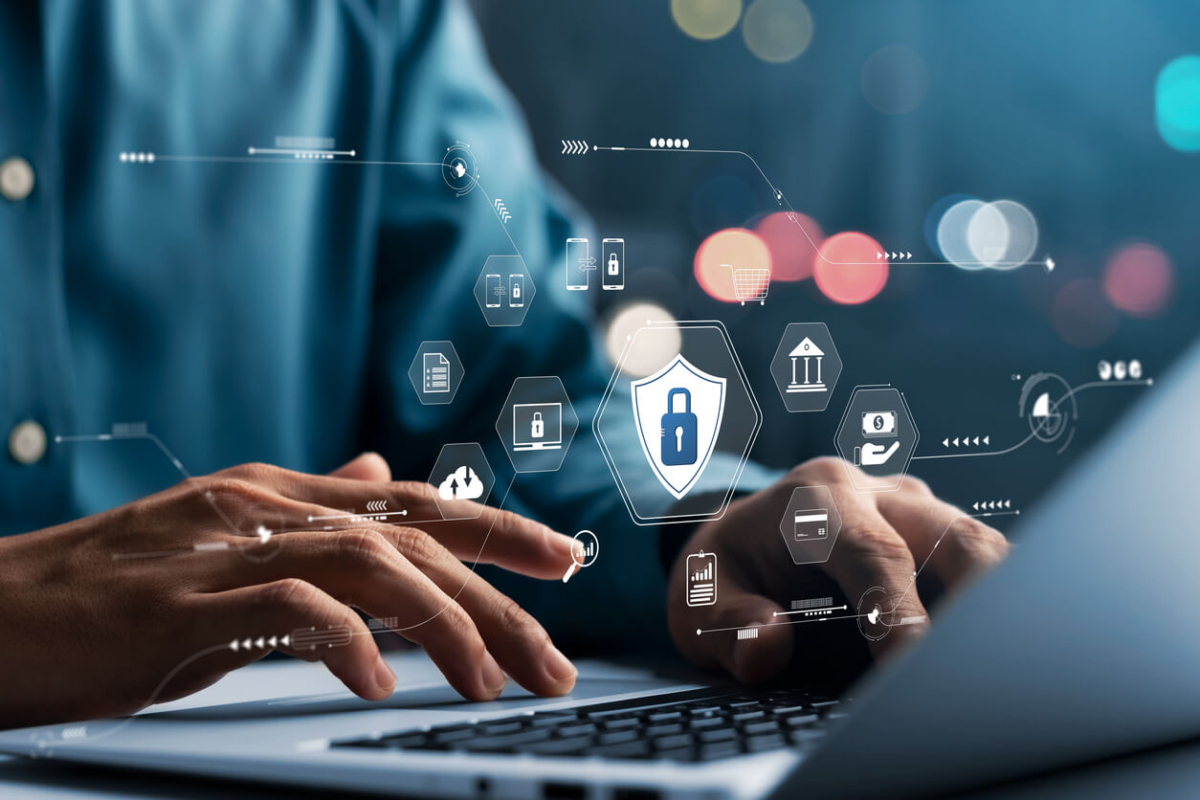hands typing on a laptop with Oleeo data driven recruitment platform on the screen